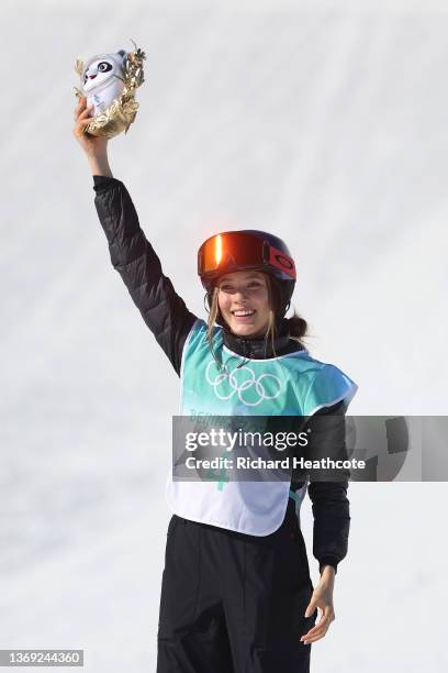 Gold medallist Ailing Eileen Gu of Team China celebrates during the Women's Freestyle Skiing Freeski Big Air flower ceremony on Day 4 of the Beijing...