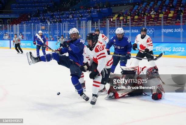 Sarah Fillier of Team Canada and Amanda Kessel of Team United States vie for the puck in the first period during the Group A Women's Preliminary...
