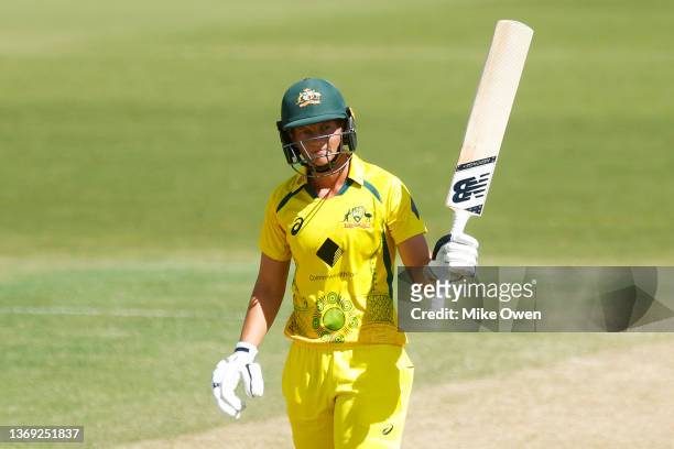 Meg Lanning of Australia raises her bat after scoring 50 runs during game three of the Women's Ashes One Day International series between Australia...