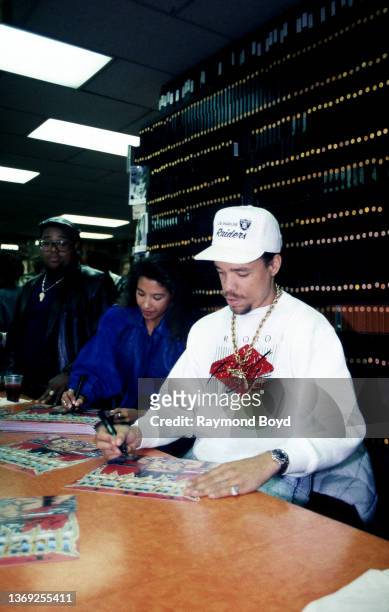 Rapper and actor Ice-T and his girlfriend Darlene Ortiz signs autographs and greets fans at Metro Music in Chicago, Illinois in October 1989.