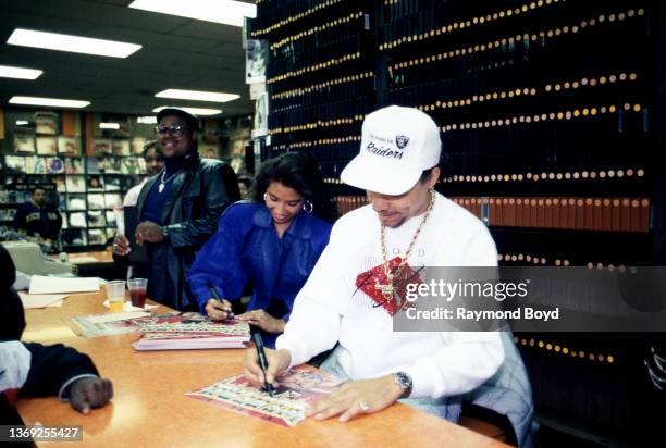 Rapper and actor Ice-T and his girlfriend Darlene Ortiz signs autographs and greets fans at Metro Music in Chicago, Illinois in October 1989.