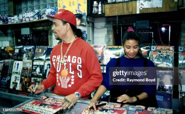 Rapper and actor Ice-T and his girlfriend Darlene Ortiz signs autographs and greets fans at Fletcher's One Stop in Chicago, Illinois in October 1989.