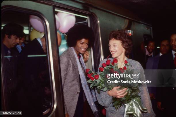 Michael Jackson, and Joan Mondale ride a subway car to the premiere of "The Wiz" at the PlayStation Theater on October 24, 1978.