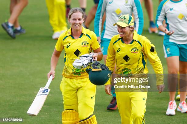 Meg Lanning and Beth Mooney of Australia celebrate after winning game three and the Women's Ashes One Day International series between Australia and...