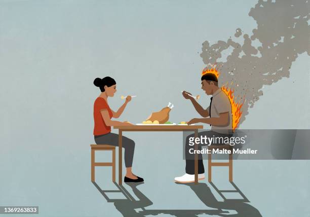 couple eating turkey dinner at table, man's back on fire - irritation stock illustrations