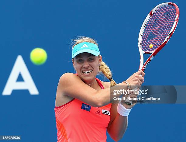 Angelique Kerber of Germany returs a shot to Mona Barthel of Germany during the singles semi final match on day six of the 2012 Hobart International...