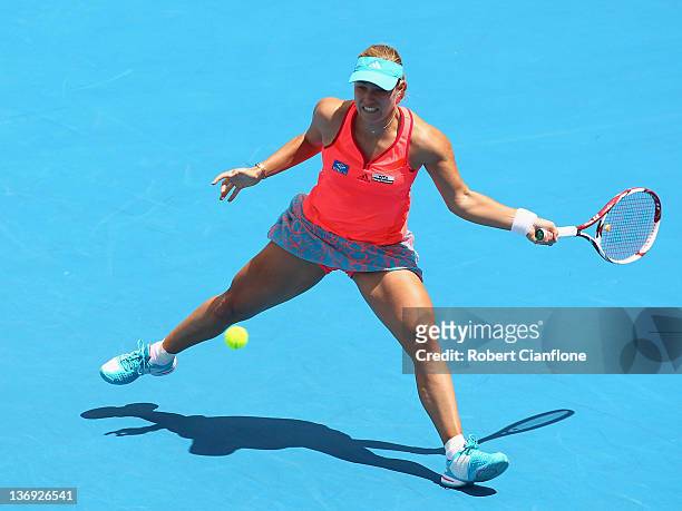 Angelique Kerber of Germany returs a shot to Mona Barthel of Germany during the singles semi final match on day six of the 2012 Hobart International...