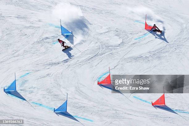 Julia Dujmovits of Team Austria and Patrizia Kummer of Team Switzerland compete during the Women's Parallel Giant Slalom 1/8 Finals on Day 4 of the...