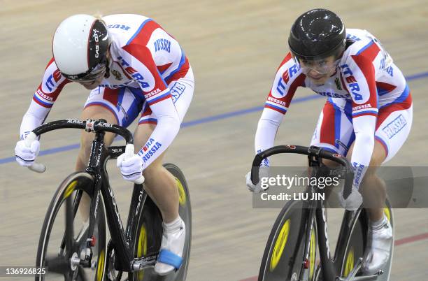 Anastasiya Voynova of Russia and her teammate Ekaterina Gnidenko compete during the women's team sprint race at the UCI Track Cycling World Cup in...