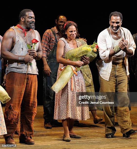 Actors Phillip Boykin, Audra McDonald and Norm Lewis join the cast to take a bow during the curtain call at "The Gershwins' Porgy and Bess" Broadway...