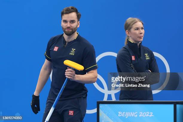 Oskar Eriksson and Almida de Val of Team Sweden look on following their victory against Team Great Britain during the Curling Mixed Doubles Bronze...