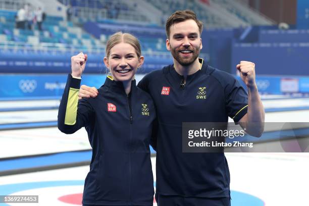 Almida de Val and Oskar Eriksson of Team Sweden pose for a photograph following their victory against Team Great Britain during the Curling Mixed...