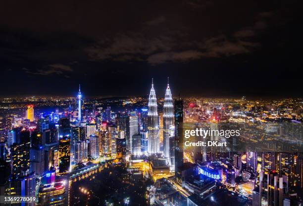 kuala lumpur skyline at night illuminations - kuala lumpur landscape stock pictures, royalty-free photos & images