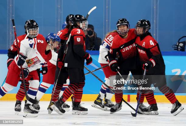 Haruka Toko of Team Japan celebrate with their team mates after scoring the opening goal in the first period during the Women's Preliminary Round...