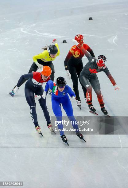 Arianna Fontana of Team Italy crosses the finish line to win the Gold medal ahead of Suzanne Schulting of Team Netherlands, Kim Boutin of Team...