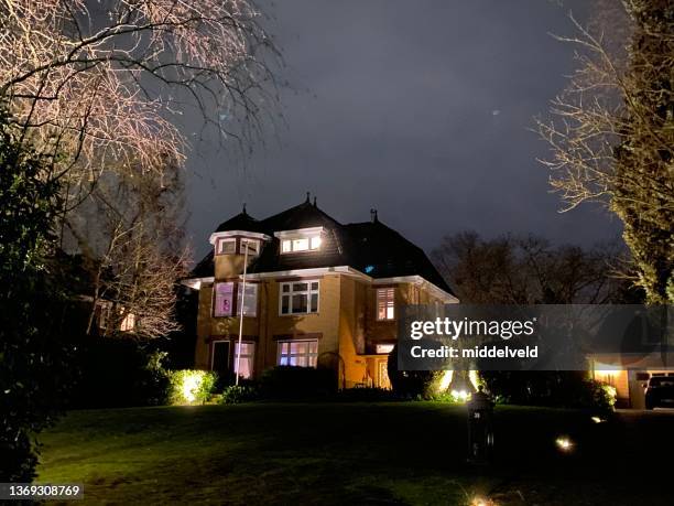 retro villa at night - limburg stock pictures, royalty-free photos & images