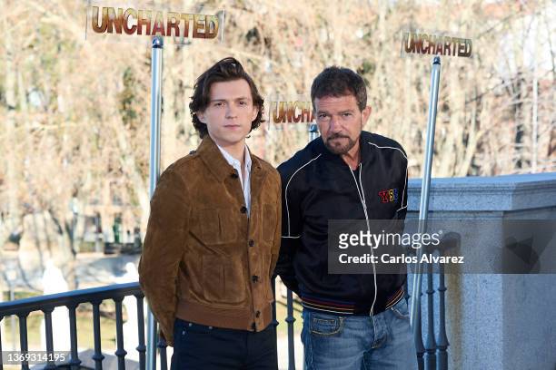 Actors Tom Holland and Antonio Banderas attend 'Uncharted' photocall at the Royal Theater on February 08, 2022 in Madrid, Spain.