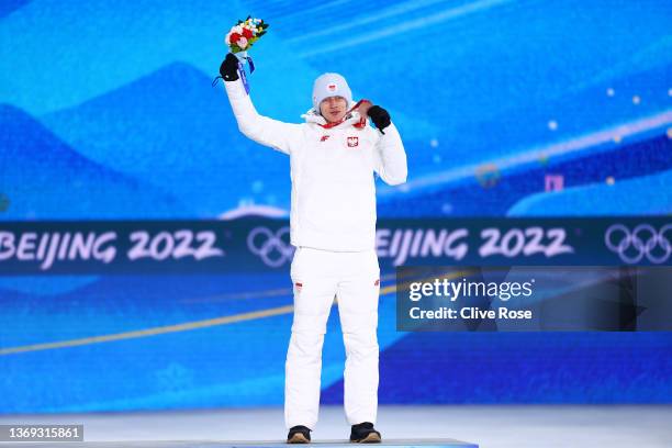 Bronze medallist Dawid Kubacki of Team Poland poses with their medal during the Men's Normal Hill Individual medal ceremony on Day 4 of the Beijing...