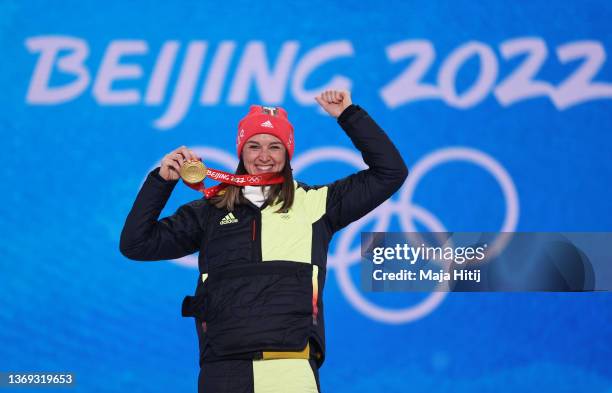 Gold medallist Denise Herrmann of Team Germany celebrates during the Women's Biathlon 15km Individual medal ceremony on Day 4 of the Beijing 2022...