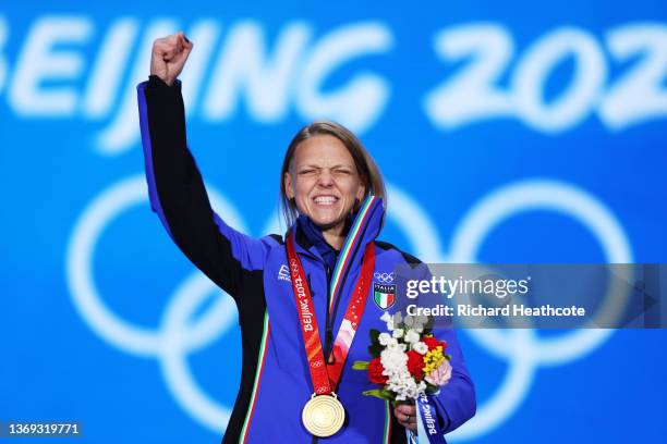 Gold medallist Arianna Fontana of Team Italy celebrates during the Women's 500m Speed Skating medal ceremony on Day 4 of the Beijing 2022 Winter...