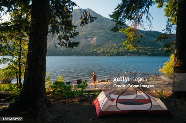 tent camping next to lake wenatchee in the north cascade mountains - wenatchee stock pictures, royalty-free photos & images