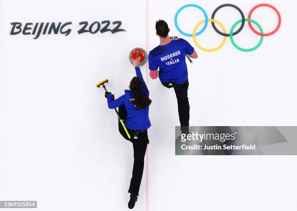 Amos Mosaner and Stefania Constantini of Team Italy compete against Team Norway during the Curling Mixed Doubles Gold Medal Game on Day 4 of the...