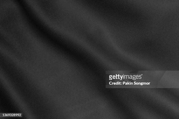 fabric background with a black fabric cloth polyester texture. - black shirt 個照片及圖片檔