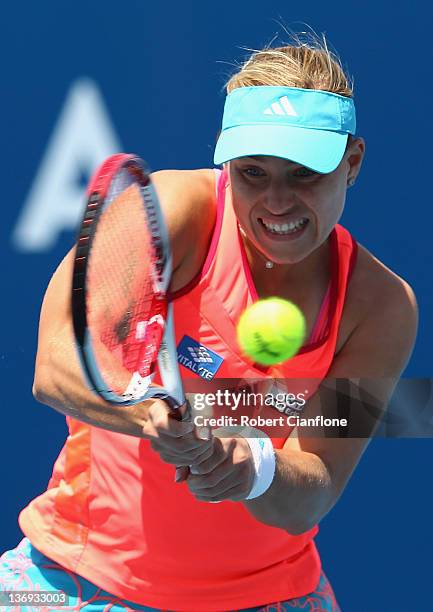 Angelique Kerber of Germany returs a shot to Mona Barthel of Germany during the singles semi final match on day six of the 2012 Hobart International...