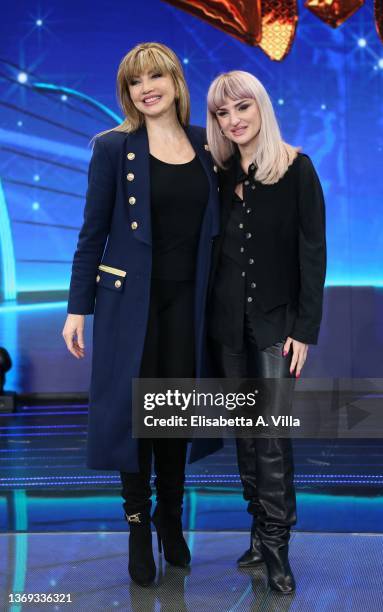 Milly Carlucci and Rosalba Pippa aka Arisa attend the photocall of the tv show "Il Cantante Mascherato" at Auditorium Rai on February 08, 2022 in...