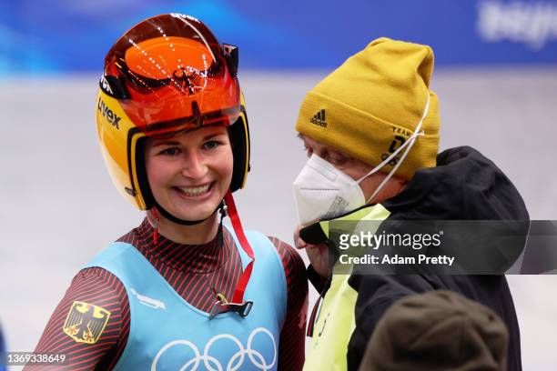 Julia Taubitz of Team Germany reacts with her coaching staff after her Women's Singles Luge Run 4 on day four of the Beijing 2022 Winter Olympic...