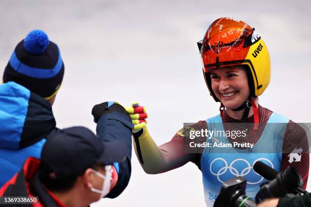 Julia Taubitz of Team Germany reacts with her coaching staff after her Women's Singles Luge Run 4 on day four of the Beijing 2022 Winter Olympic...