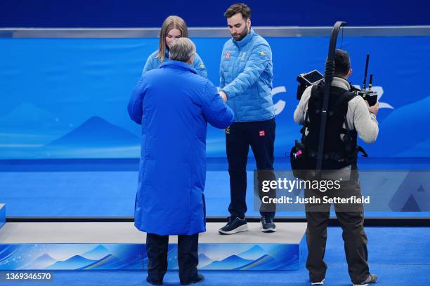 Bronze medallists Almida de Val and Oskar Eriksson of Team Sweden receive their medals from Shamil Tarpishchev, IOC Member during the Curling Mixed...