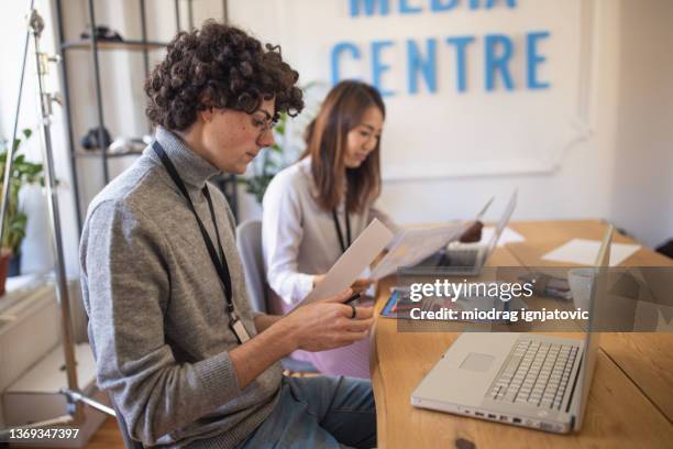 multiracial coworkers at the editorial office, having a meeting about next publication - copy editor stock pictures, royalty-free photos & images