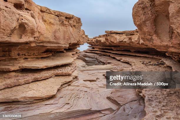 low angle view of rock formations against sky,bahabad,yazd province,iran - iran landschaft stock-fotos und bilder