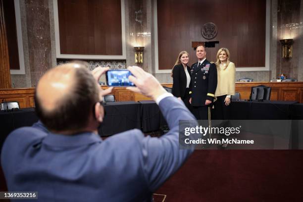 Lieutenant General Michael E. Kurilla , his wife Mary Paige and daughter Michelle pose for a family photo in the hearing room before Kurilla...