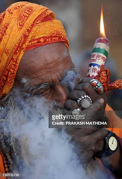 A Sadhu smokes ganja in a chillum as a holy offering from Lord Shiva,...  News Photo - Getty Images