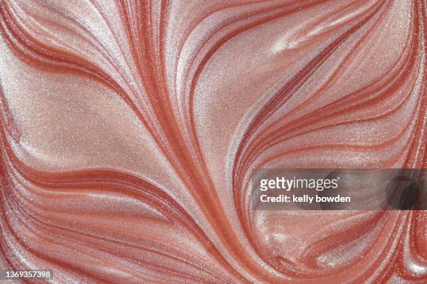 rose gold makeup paint abstract swirl - metalic make up stock pictures, royalty-free photos & images