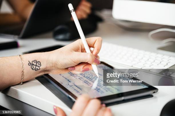 close up of woman using digital tablet during seminar - digitized pen stock-fotos und bilder