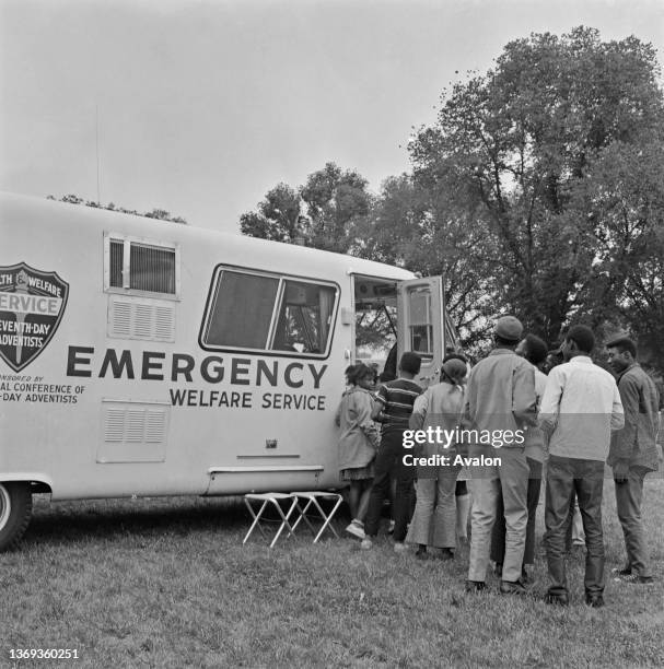 Residents at Resurrection City, a community squat housing project to protest against living conditions of Black Americans, queue outside a mobile...