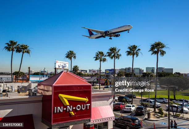 An In-N-Out hamburger restaurant adjacent to a runway at Los Angeles International Airport has become a favorite Instagram spot to photograph jets as...