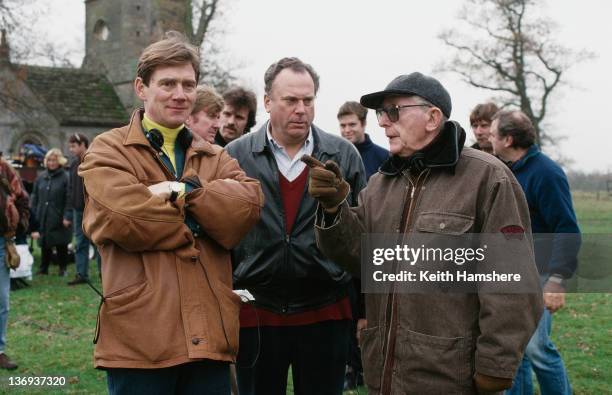 From left to right, actor Anthony Andrews, co-producer William P. Cartlidge and director Lewis Gilbert on the set of the film 'Haunted', 1995.