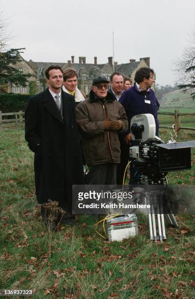 From left to right, actors Aidan Quinn and Anthony Andrews, director Lewis Gilbert, co-producer William P. Cartlidge and another crew member on the...