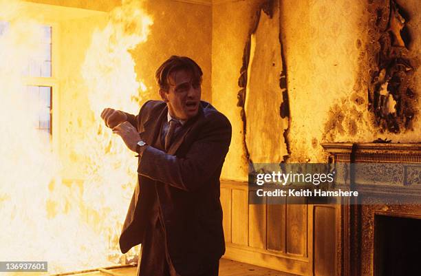 American actor Aidan Quinn is trapped in a house fire in a scene from the film 'Haunted', 1995.