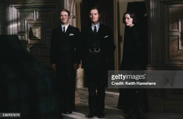 From left to right, English actors Alex Lowe, Anthony Andrews and Kate Beckinsale as ghostly siblings in a scene from the film 'Haunted', 1995.
