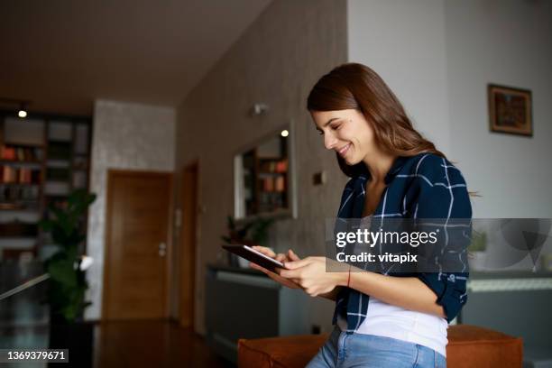 woman with digital tablet at home - customer profile stock pictures, royalty-free photos & images