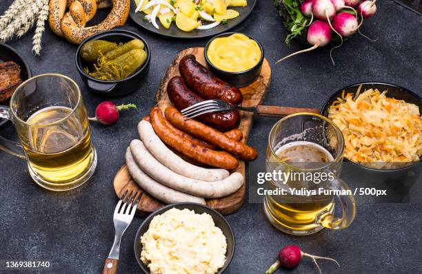 beer fest dishes with beer,pretzel and sausage - oktoberfest home stock pictures, royalty-free photos & images