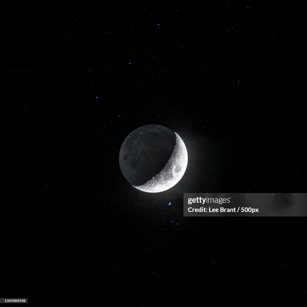 Low angle view of moon against sky at night