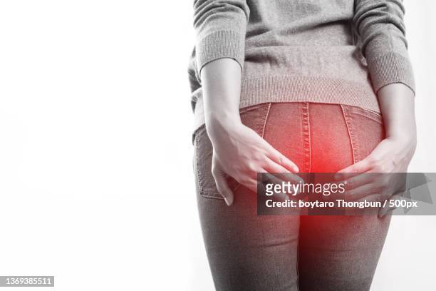 concept of health problems woman has hemorrhoids - woman hemorrhoids stock pictures, royalty-free photos & images