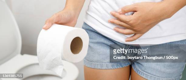 portrait of a woman suffers from diarrhea - woman hemorrhoids stock pictures, royalty-free photos & images
