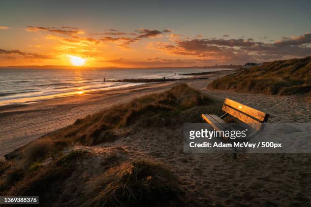 hengistbury head at sunset,scenic view of beach against sky during sunset - mcvey stock pictures, royalty-free photos & images
